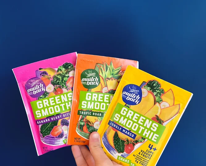 Hand holding Switchback smoothie packets